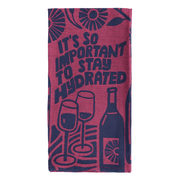 Folded Funny tea towel with wine bottles, glasses, and the phrase “It’s so important to stay hydrated”