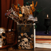 Steel Mill Hamlet book vase used as dried flower decor with books and gothic home accessories