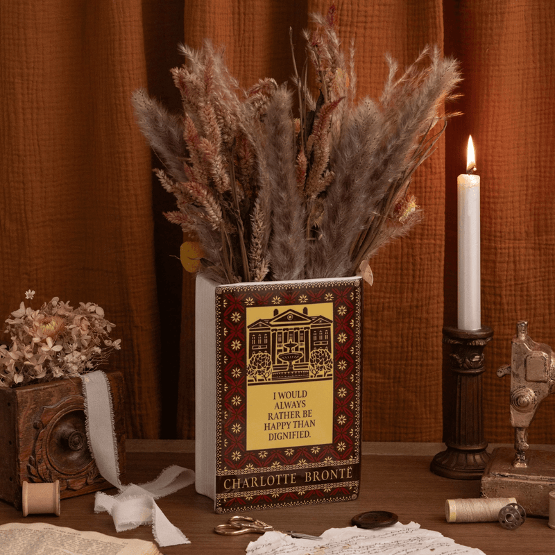 Reverse of the Jane Eyre book vase displayed with dried flowers