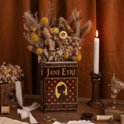 Jane Eyre ceramic book vase displayed with dried flowers and vintage accessories