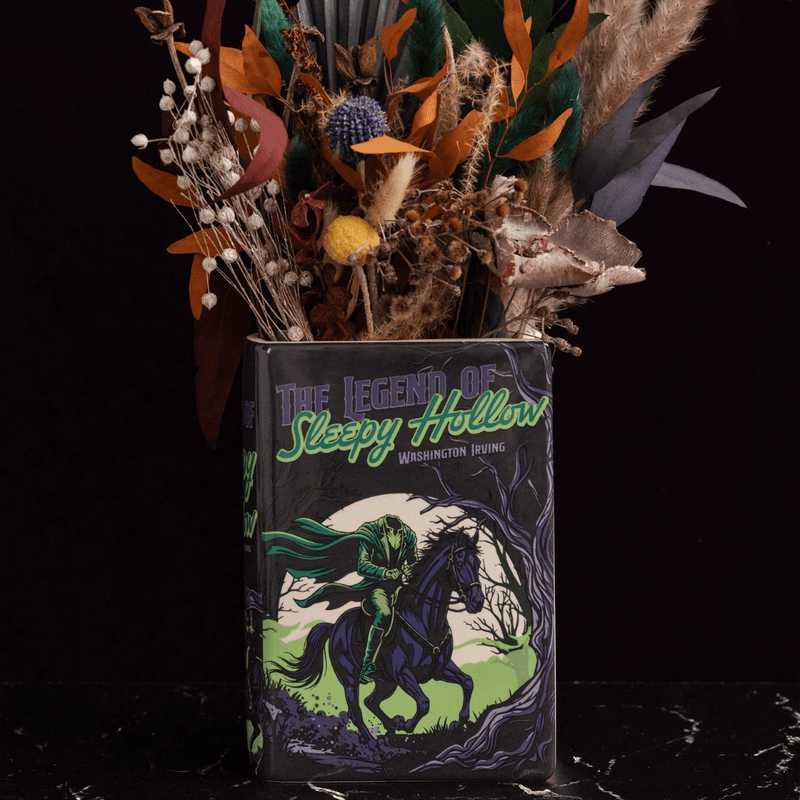 Front of the Sleepy Hollow book vase displayed with an autumnal dried flower arrangement