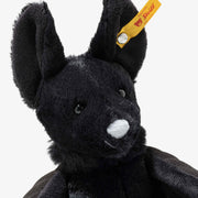 Side view of Steiff Boris Bat with cape-like wings folded back