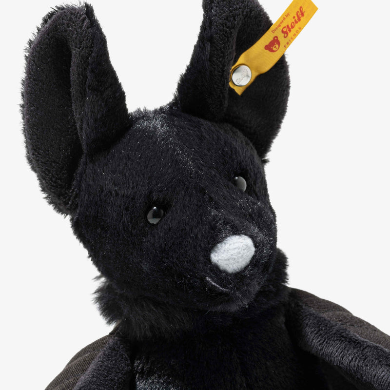 Side view of Steiff Boris Bat with cape-like wings folded back