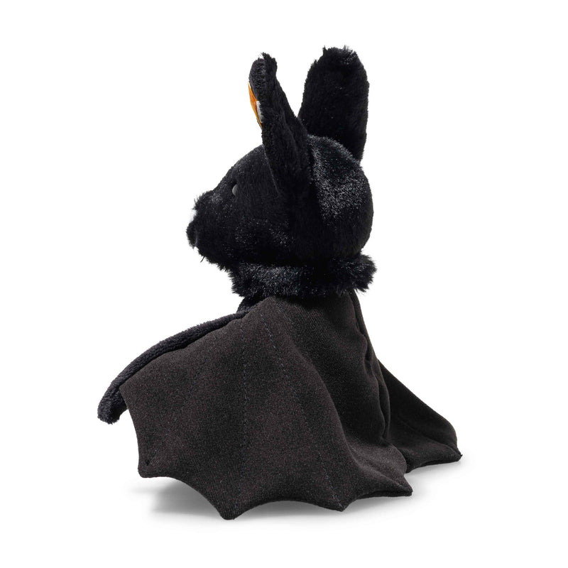 Close-up of Boris Bat showing velvety black fur, white nose and Steiff ear tag