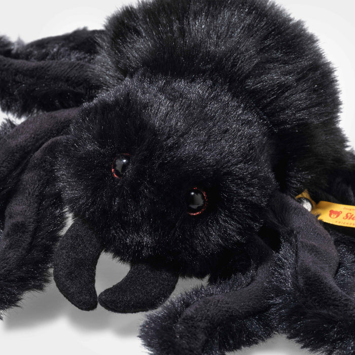 Three-quarter view of Steiff Cobweb Spider with fluffy body and felt fangs
