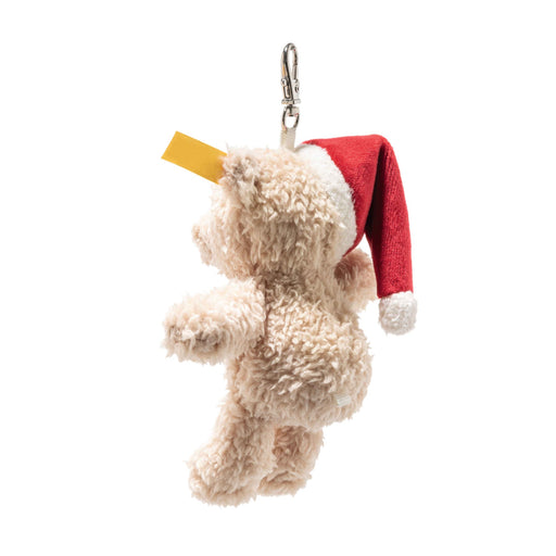 Rear angled view of Steiff Ben teddy bear keyring with clip and Santa hat