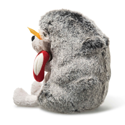 Side view of Steiff Hedgy Hedgehog with plush spines and striped candy cane