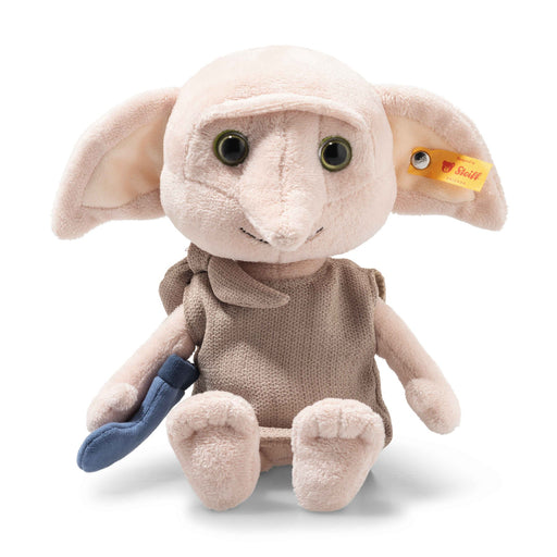 Steiff Dobby plush toy sitting with blue sock and fabric tunic, front view, large ears and yellow Steiff ear tag.