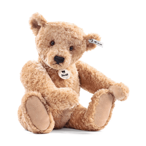 Steiff Elmar Teddy Bear in soft beige plush sitting forward with the new ecru and grey ear tag on a white background