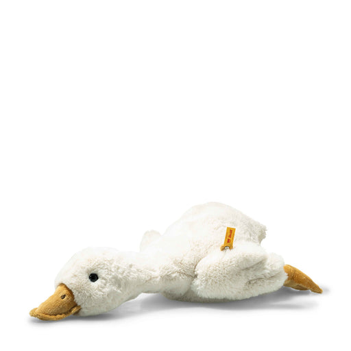 Side view of Steiff Gilda goose plush lying on its belly with Button in Ear – Steiff bears