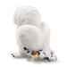 Back view of Steiff Hedwig snowy owl plush showing wings, speckled tail and yellow ear tag