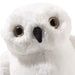 Front close-up of Steiff Hedwig snowy owl plush with amber eyes and black beak