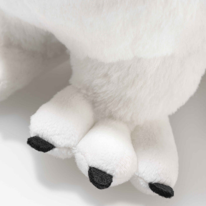 Close-up of Steiff Hedwig snowy owl plush feet with black claws