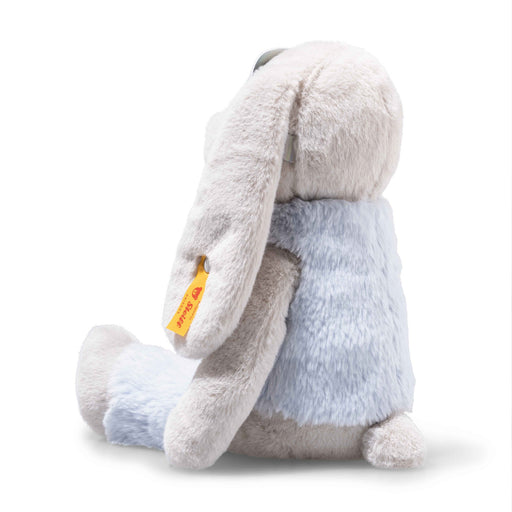 Rear angled view of Steiff Hoppie Bunny with long floppy ears and ear tag