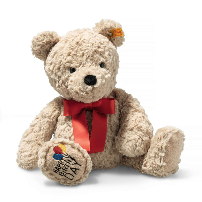 Front view of Steiff Jimmy Teddy Bear Happy Birthday with red bow, paw embroidery and Button in Ear – Steiff teddy bears