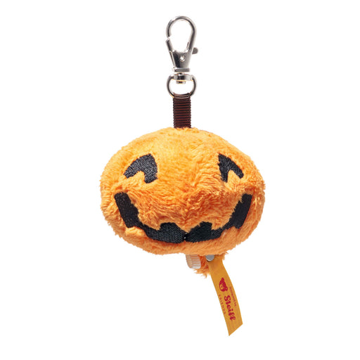 Front view of Steiff Little Pumpkin plush keyring with smiling jack-o-lantern face and clip