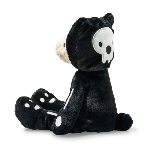 Side view of Mr Bones teddy showing skull hood and paw pad details