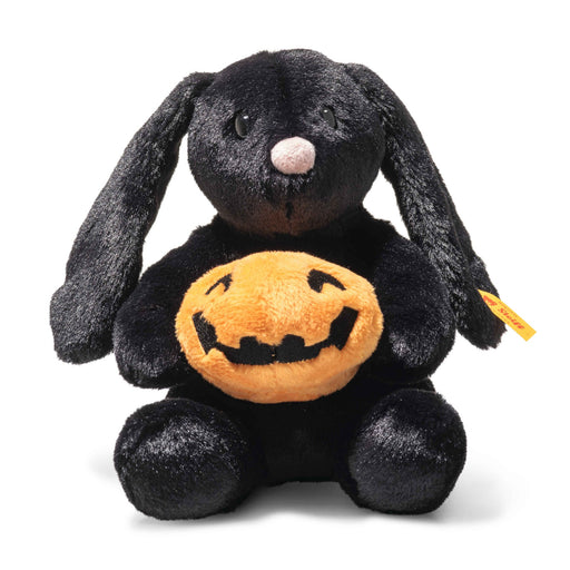 Front view of Steiff Mr Spice Hoppie bunny holding a plush pumpkin