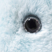 Close-up of Steiff Patronus Stag plush glossy eye and soft blue fur