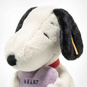 Side profile of Snoopy showing soft black ears, red collar and Steiff ear tag