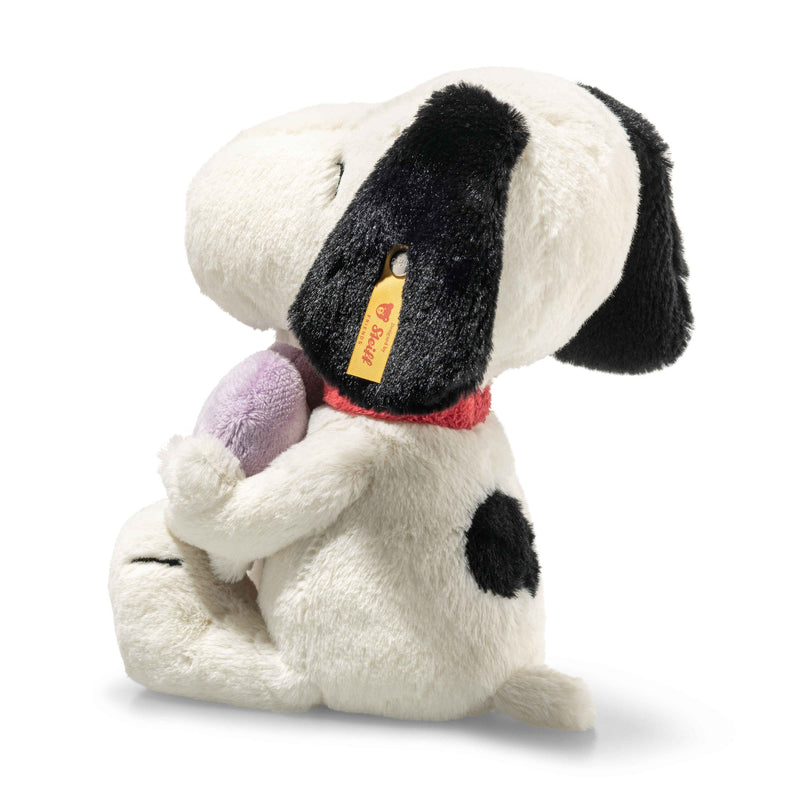 Right-side angled view of Snoopy plush with closed eyes and Heart Breakers Club heart