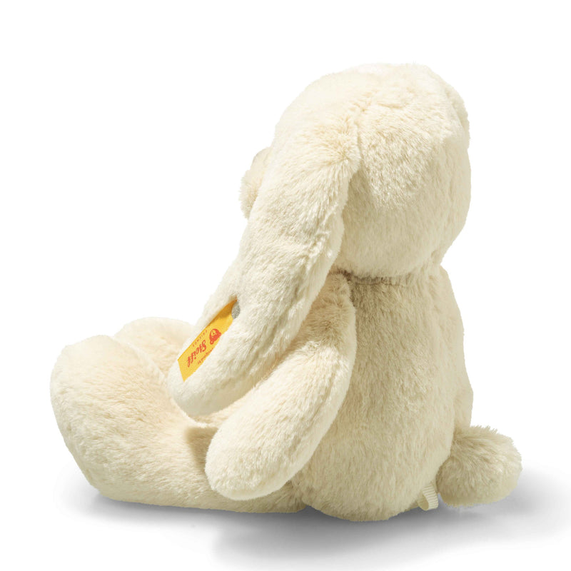 Steiff Tilda rabbit plush, rear angle showing fluffy tail and yellow ear tag – Steiff teddy bears.
