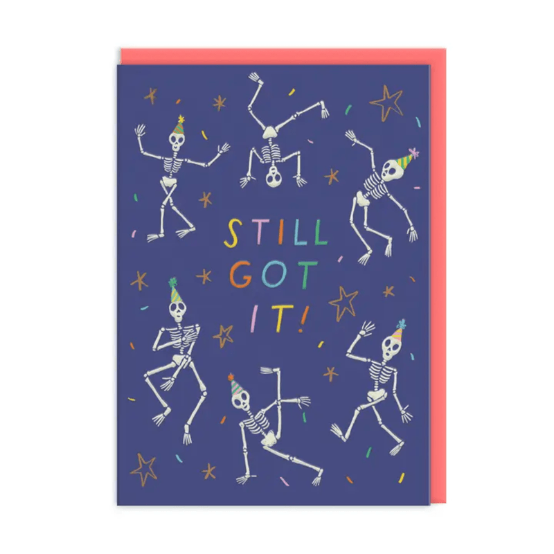 Still Got It skeleton birthday card by Emily Doliner with dancing skeletons in party hats