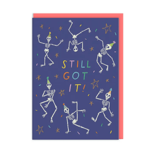 Still Got It skeleton birthday card by Emily Doliner with dancing skeletons in party hats