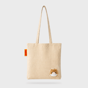 Full front view of the SUCK UK Peeky Cat natural cotton shopper with long cream handles and a fluffy orange-and-white kitten face.