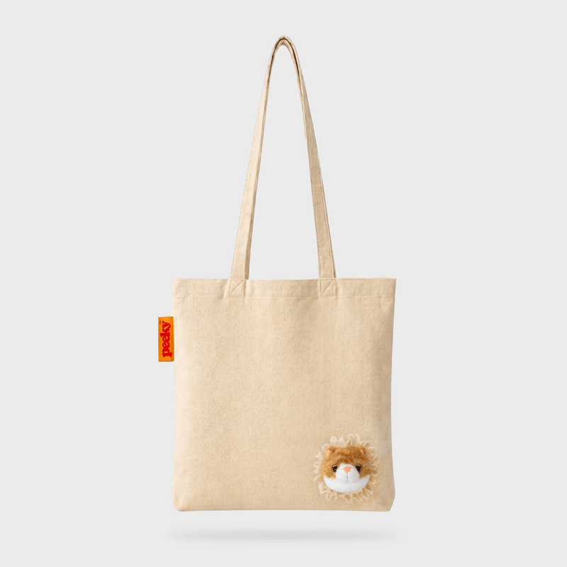 Full front view of the SUCK UK Peeky Cat natural cotton shopper with long cream handles and a fluffy orange-and-white kitten face.