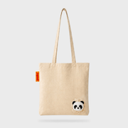 Full front view of the SUCK UK Peeky Panda natural cream cotton tote bag with long handles and a three-dimensional black-and-white panda head.