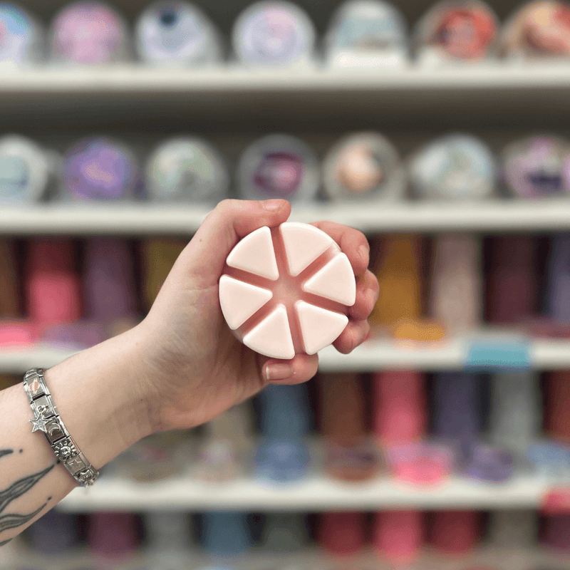 Sweet Fairy pale pink segmented wax melt held in hand