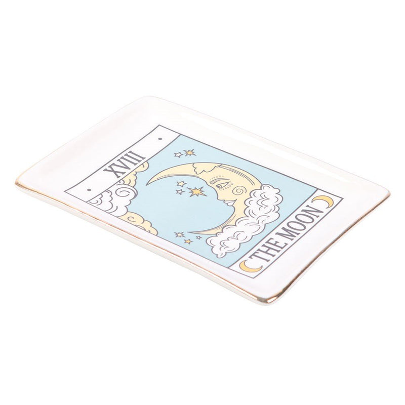 Angled view of gold-edged Tarot The Moon ceramic dish on white background.
