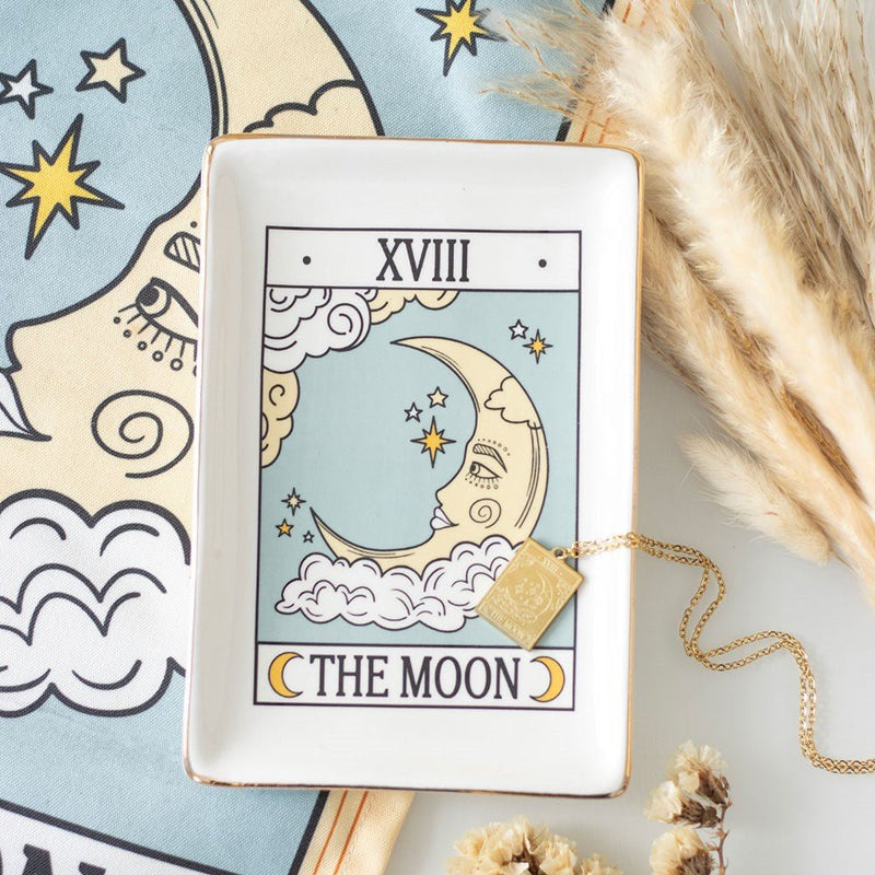 Tarot The Moon ceramic trinket dish styled with necklace and pampas grass.
