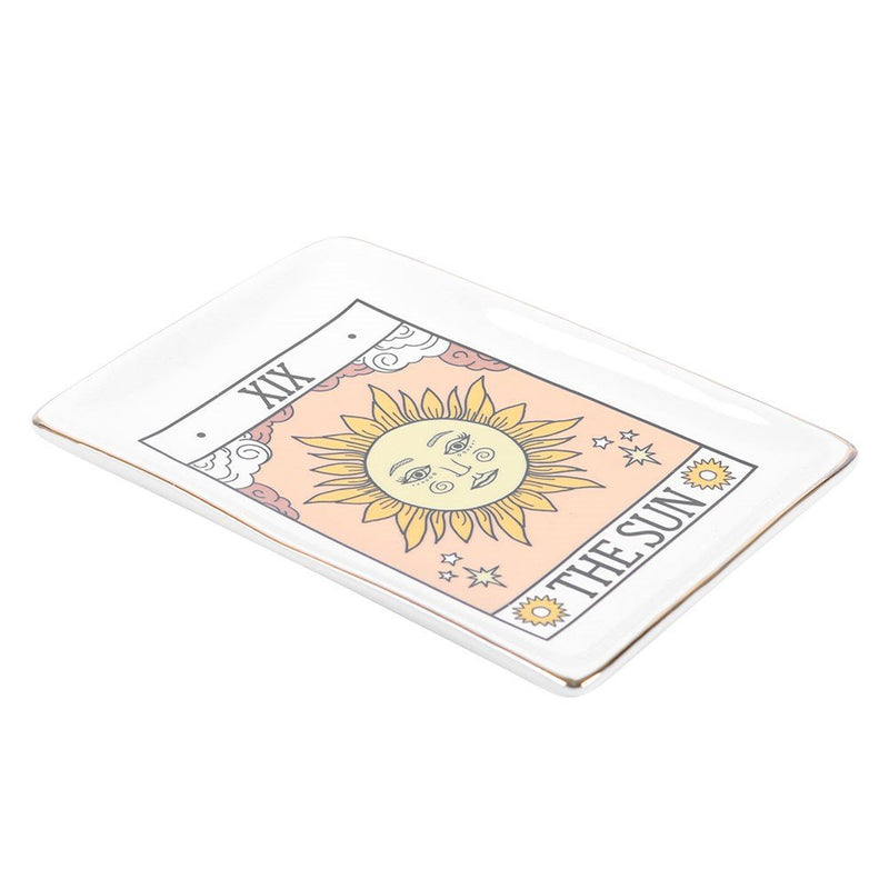 Angled view showing gold-edged ceramic Tarot The Sun trinket dish.
