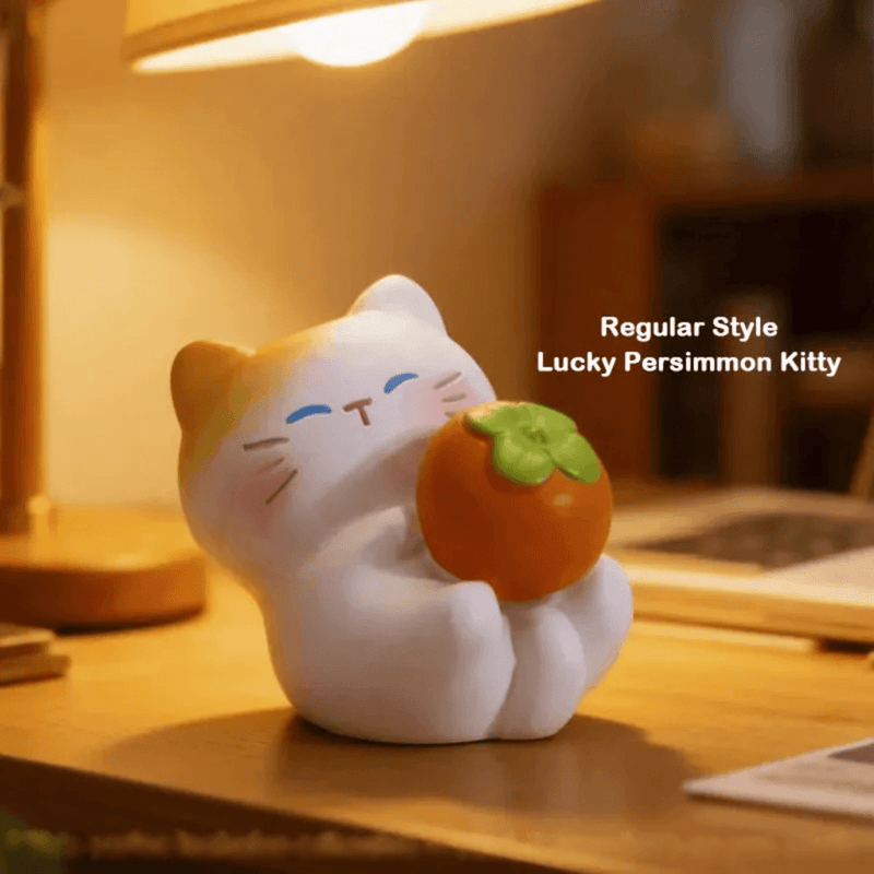 Lucky Persimmon Kitty holding an orange persimmon from The Cat Come blind box series
