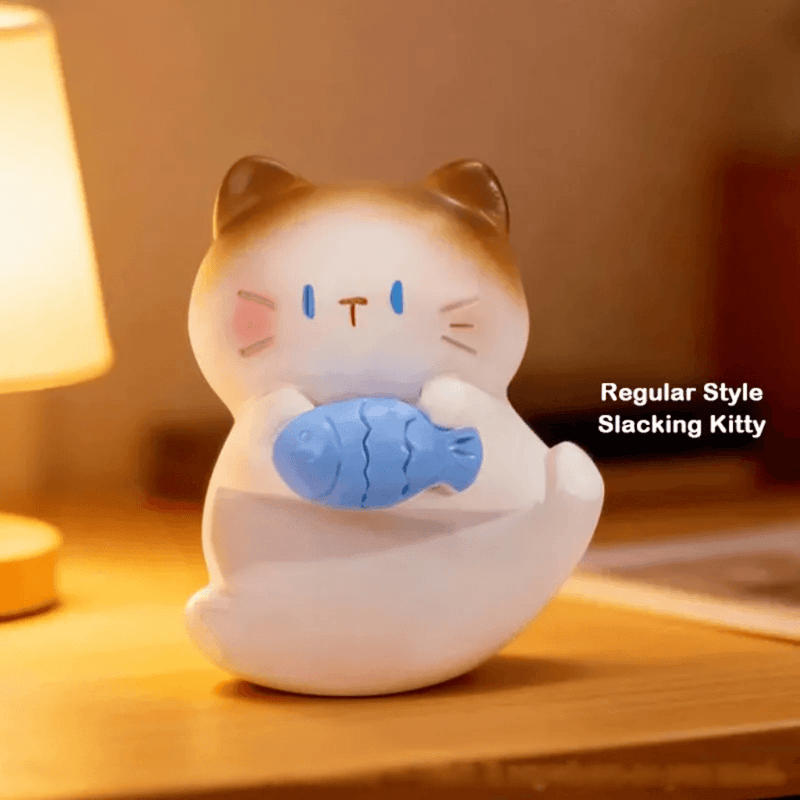 Slacking Kitty holding a blue fish from the ThingsWoo The Cat Come Series