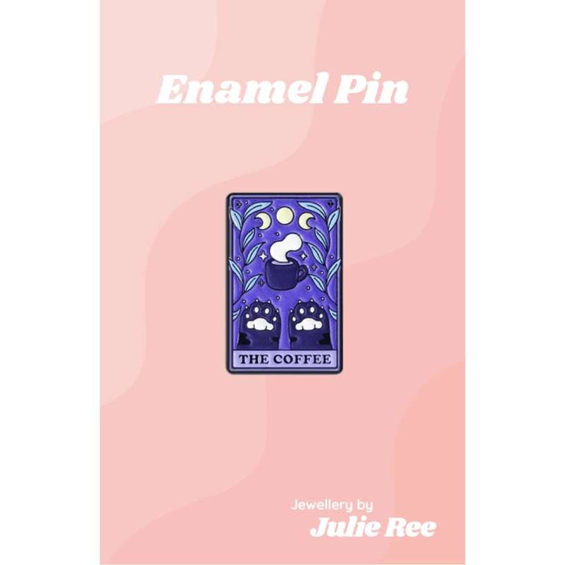 Purple tarot-style enamel pin with a steaming coffee cup, moon phases and cat paws that says The Coffee