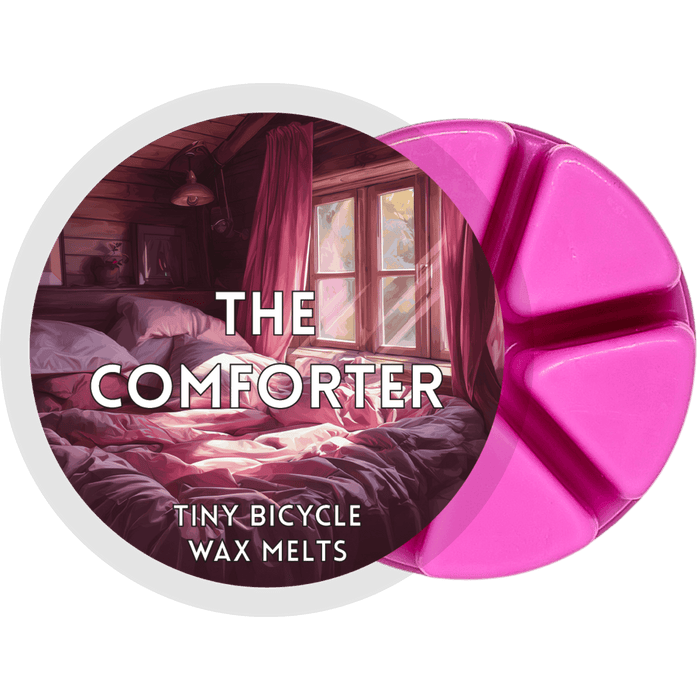 The Comforter segmented wax melt pot with pink wax segments and cosy bedroom label design