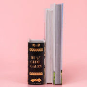 Side view of Great Gatsby ceramic book vase showing sculpted pages