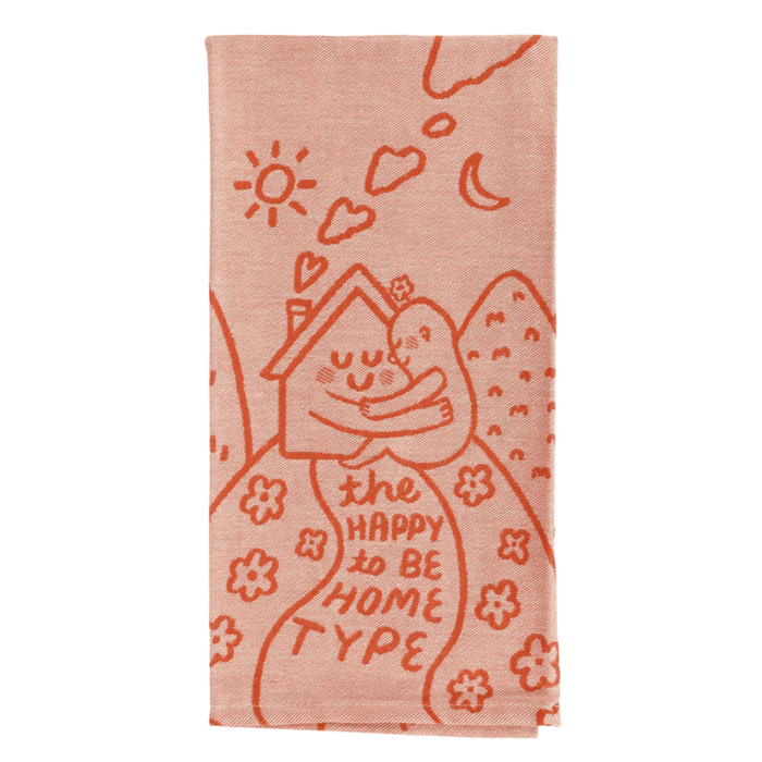 Folded The Happy To Be Home Type tea towel, peach woven illustration and text.