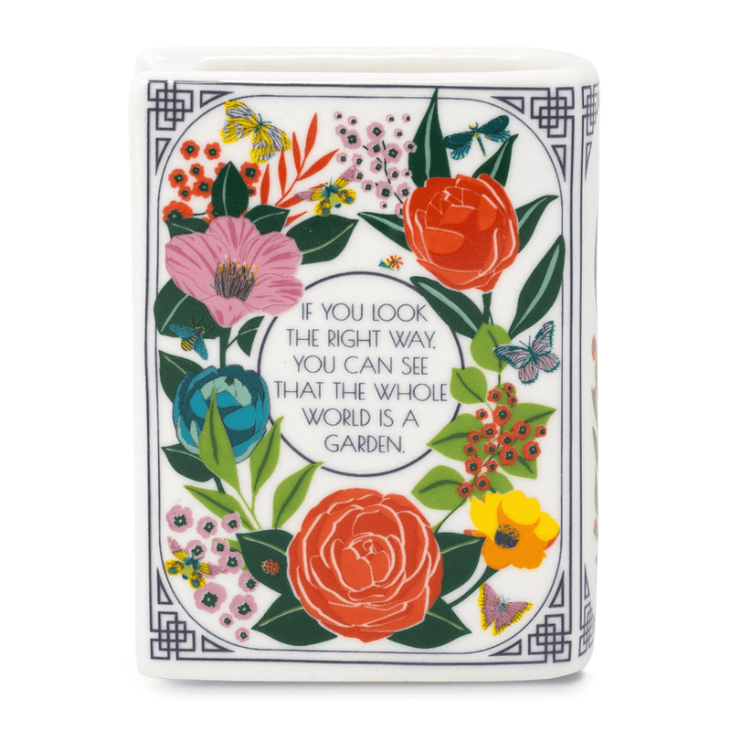 Back cover of The Secret Garden book shaped candle with floral artwork and garden quote.