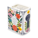 The Secret Garden book candle showing floral quote panel and spine key motif from an angled top view.