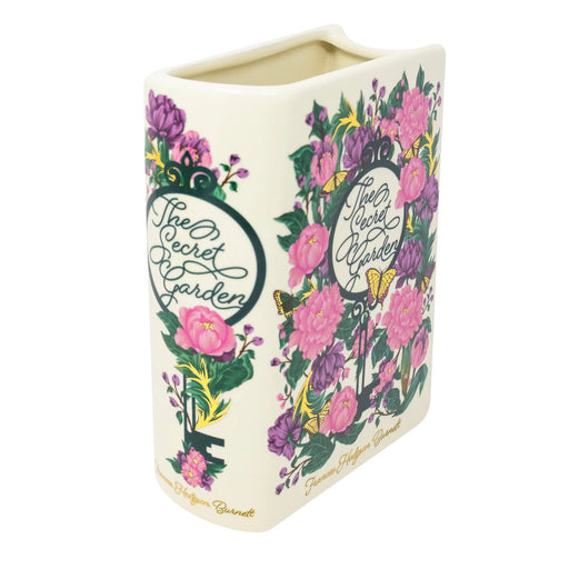 Angled front view of The Secret Garden ceramic book vase with pink and purple florals on cream.