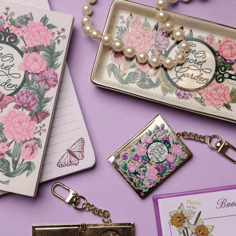 The Secret Garden literary trinket tray with pearl necklace and matching bookish accessories
