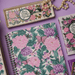 The Secret Garden literary trinket tray on purple background with notebook and gift items
