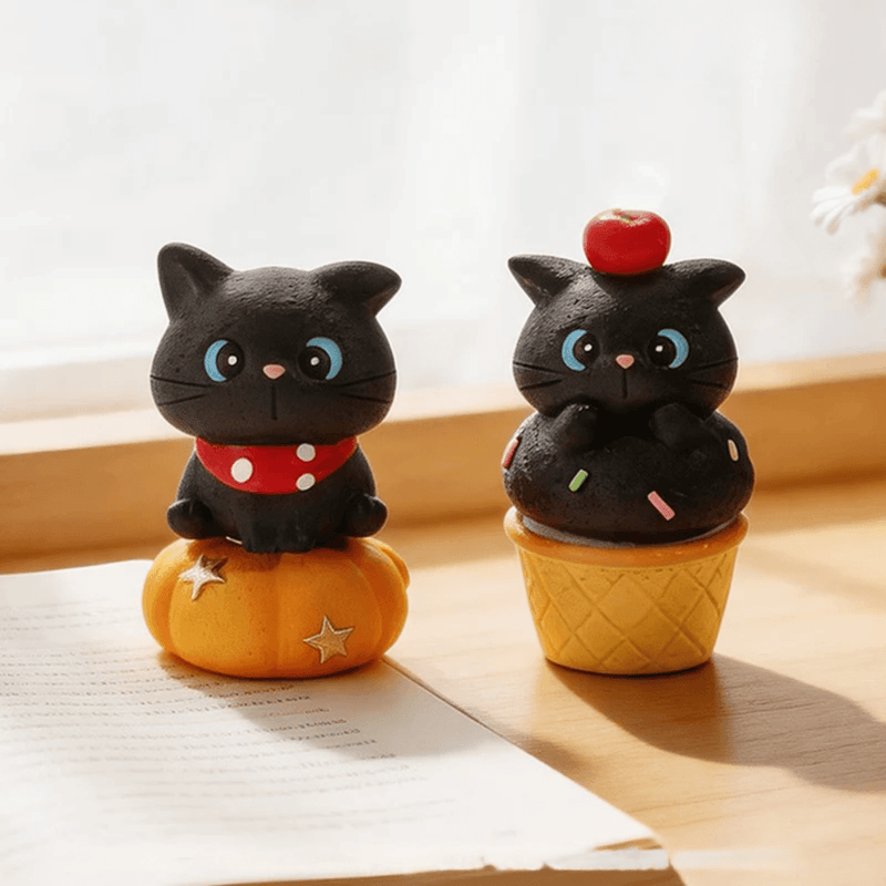 Two black cat figures from the ThingsWoo Wonderful Adventure collection displayed together