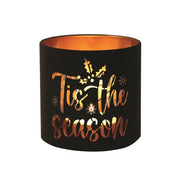 Round black and gold Tis the Season tealight candle holder shown lit