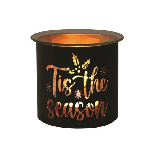 Black and gold Tis the Season tealight wax melter glowing with warm light