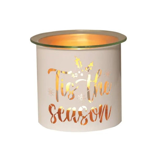 White and gold Tis the Season tealight wax melter glowing with warm light